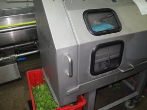 This special machine chops lettuce into bite-size pieces.