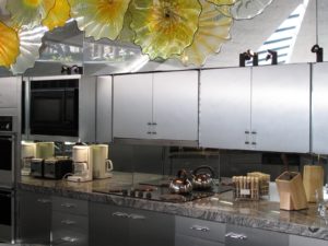 The Elrod house kitchen, with Dale Chihuly sculpture overhead