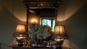 More 'Tardiva' hydrangeas were arranged in an amber Steuben vase on a side table. I love how the light from the mercury glass lamps cast great shadows of the lamp shades on the walls.