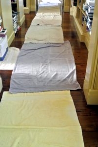 Before moving the piano, we lined the entire hallway with towels to protect the hardwood floors.