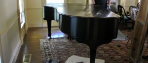 This piano is nearly seven-feet long, and about five-feet wide. It also weighs more than 750-pounds, so it was crucial to have it moved professionally.