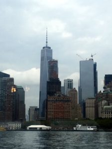 The tall building is the Freedom Tower, One World Trade Center, the main building of the rebuilt World Trade Center complex in Lower Manhattan, New York City. It is the tallest building in the Western Hemisphere, and the sixth-tallest in the world.