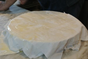 Brushing each sheet of phyllo with butter is important so that it bakes golden, crisp, and flaky.