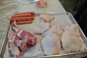 Here are the meats for the couscous dish - lamb, sausage and chicken. A separate tray of Kosher meats is also prepared.