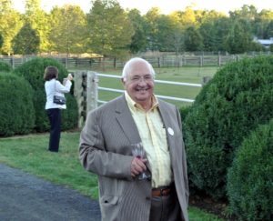 This is Allen Kosowsky - his wife, Leonore, is in the background, and stopped to take a photo of my Friesians grazing in the paddock.