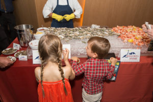 My grandchildren, Jude and Truman, also stopped by and loved the oysters. (Photo by Mike Krautter)