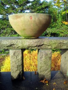 The bowl planter is on the ledge of the west terrace. It is a Soderholtz pot made out of reinforced concrete from the 1920s. Eric Soderholtz was a pioneer in American garden pottery and a most creative artist of concrete formations.