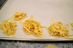 Once the fettuccine was made, I placed batches on a parchment paper covered tray. I showed the entire process for making pasta on my television show, "Martha Stewart's Cooking School" - the recipe is on my web site. http://www.marthastewart.com/972476/basic-pasta
