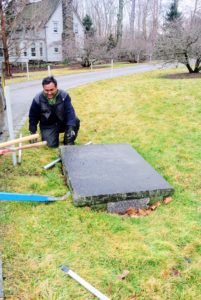 My catch basins are covered with bluestone caps. The grated drain openings are on the sides. If you have catch basins or storm drains on or near your home's property, be sure they are checked and cleaned regularly and especially before a storm.