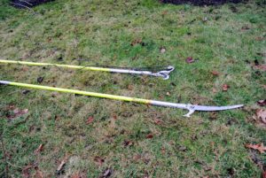 This top tool is a pole pruner, or lopper, attachment and a telescoping pole - it's used to cut branches in high, hard to reach areas that are about an inch to an inch and half thick. The larger of the two is a pole saw. It also attaches to a telescoping pole, and is used to prune branches at least an inch-thick.