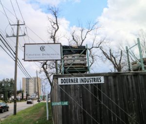 The Chateau Domingue street sign marks the expansive stone yard that houses all of its reclaimed building materials.