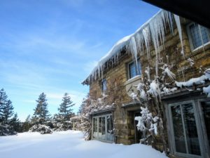 Some icicles need to be knocked down - they are so long. Icicles elongate by the growth of ice as a tube and the right mixture of air temperature, wind speed and the water feeding it.