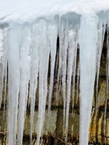 Icicles are so pretty. They form on surfaces which might have a smooth and straight, or irregular construction - this influences the shape of an icicle.