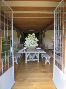 The Living Hall at Skylands is always used during summer months. This grand faux-bois cement table, made by artist Carlos Cortes, is where I like to display large flower arrangements for my parties.