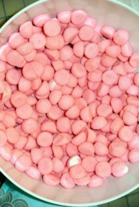 These are pink, chewy candy balls.