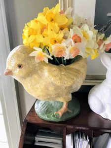 My executive assistant, Shqipe, picked some beautiful daffodils to place in the glass vase inside this paper mache chick. Wait until you see my long daffodil border this year - the flowers are coming up so wonderfully.