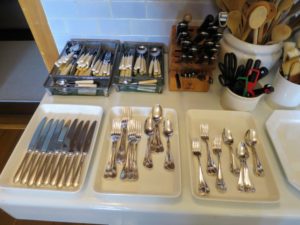 All the flatware is displayed on the fishmonger's table - big hands and small hands can grab whatever is needed.