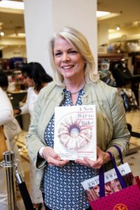 Guests were instructed to purchase their books before the event started. This guest had already picked out some recipes she wanted to try at home. (Photo by Richard Allsopp for Macy’s Inc.)