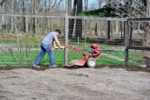 Wilmer tilled the garden with our trusted Troy-Bilt Pony Rear-Tine Tiller. It helps to level the ground as it turns over the soil.
