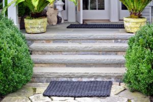 On my large back porch, I have two - one at the bottom of the steps, and one in front of the door. When selecting a doormat, choose the biggest mat your space will allow, so visitors are sure to place both feet on the mat - not just one.