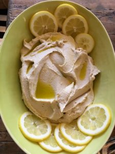 Here is a wonderful lemon hummus - homemade by Patsy. Hummus is a dip or spread made from cooked, mashed chickpeas, blended with tahini, olive oil, lemon juice, salt and garlic. Today, it is popular throughout Middle Eastern cuisine. It can also be found in most grocery stores in North America and Europe.