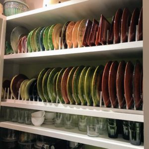 Patsy collects all sorts of pottery from her travels and has an impressive collection of French ware. She designed this storage space for many of her plates and saucers.