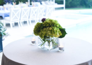 Simple yet elegant floral centerpieces adorn the tables. (Photo by Joe Schildhorn/BFA.com)