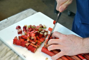 Here is Pierre chopping it up. Because it’s so tart, rhubarb should always be cooked with a sweetener. It’s usually used in baked desserts like crisps and crumbles, cakes, and pies. You can also toss it with honey, roast briefly, and then add to salads or serve with meats.