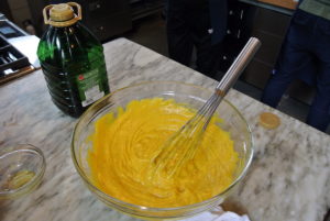 Pierre continued to whisk in the olive oil until it was smooth.