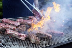 Pierre grilled ribeye steaks on a second grill. (Photo by Phillip Lehan)
