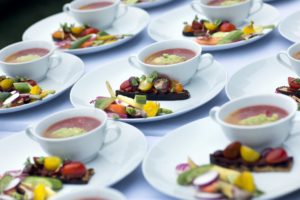 The first course featured fresh summer flavors - a delectable yellow and red gazpacho with crushed avocado, accompanied by crudité and heirloom tomato crostini. (Photo by Phillip Lehan)