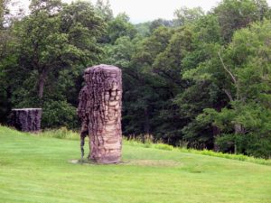 This is Ursula von Rydingsvard's 'For Paul', 1990-92/2001 and ‘Luba', 2009–10. The primary material used is four-by-four lengths of cedar wood, which the artist stacked, glued, and cut freehand with a circular saw.