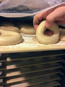 The bagels are made every morning by hand.