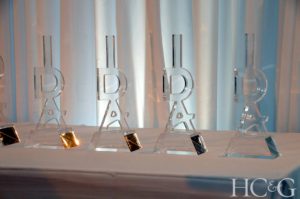 A row of IDA trophies sits on a nearby table ready for distribution to the recipients. (Photo by Richard Lewin for HC&G)