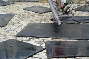 Once they are power washed, the mats are dried with a leaf blower and then left under the sun to dry even more.