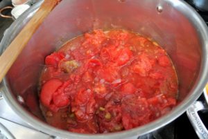And in the red batch of tomatoes, my special tip - add a touch of sugar, about a teaspoon. The orange sauce won't need it.