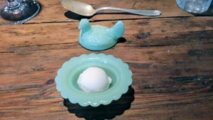Homemade Thai basil sorbet is served in milk glass chickens after the oysters - it cleanses the palate before the next course arrives.