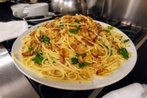 I made pasta with bucatini - also known as perciatelli, it is a thick spaghetti-like pasta with a hole running through the center. The bucatini was served with greens, garlic broth and garlic chips.