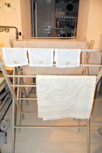 After washing linens, they should be tumble dried until they are just damp - the water and moisture will release some of the wrinkles and make ironing much easier.