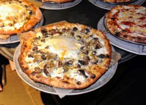 This one is a mushroom, three cheeses and a farm egg pizza.