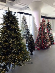 These trees are so life-like - they mimic white pines, fir, and spruce. We work very hard to develop trees that look as natural as possible. All these trees are displayed in one of several photography studios at our New York City Headquarters in the historic Starrett Lehigh Building. It is such a wonderful space to use for our Facebook LIVE broadcasts - the trees just shimmer.