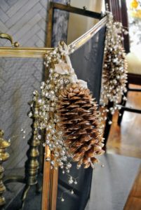 Laura hung these pinecone ornaments on the fireplace screen - such a pretty touch.