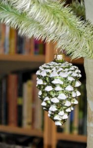And each tree is decorated with only a single ornament at the bottom - this one is a green pinecone.