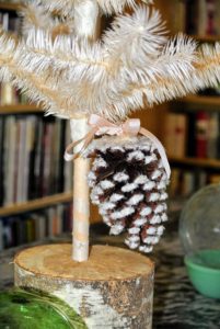 And this one is a natural colored pinecone with a pink ribbon to match the tree.