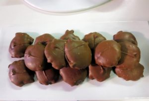 The Pecan Caramel Clusters are enrobed in chocolate and filled with caramel and pecans.