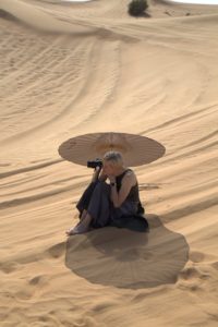 My daughter, Alexis, is a very talented photographer, and took many photos of the children enjoying their time on the sand. She brought a beautiful parasol to shade herself from the desert sun.