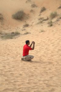 Here is one of our guides from Arabian Adventures taking snapshots. This tour company was so helpful and knowledgable - we were in great hands. https://www.arabian-adventures.com/