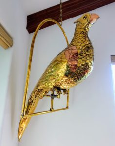 Here is a brass and copper bird by Sergio Bustamante hanging in Lisbeth's home - the perch is also made of brass. Sergio actually studied architecture at the University of Guadalajara, but abandoned this pursuit when his interests drew him to fine arts and crafts.