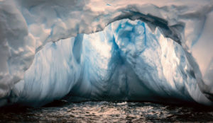 This photo shows a cavernous section of one of the icebergs, with light shining from above.