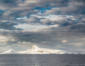 Here is a beautiful and most natural photo of the clouds and the mountains over Gerlache Strait.